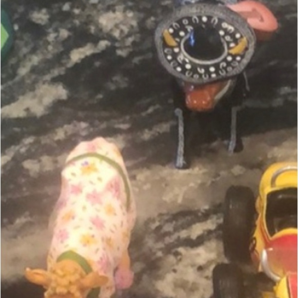 2 cow parade cows for sale. 1 matador and 1 cow in a house coat.